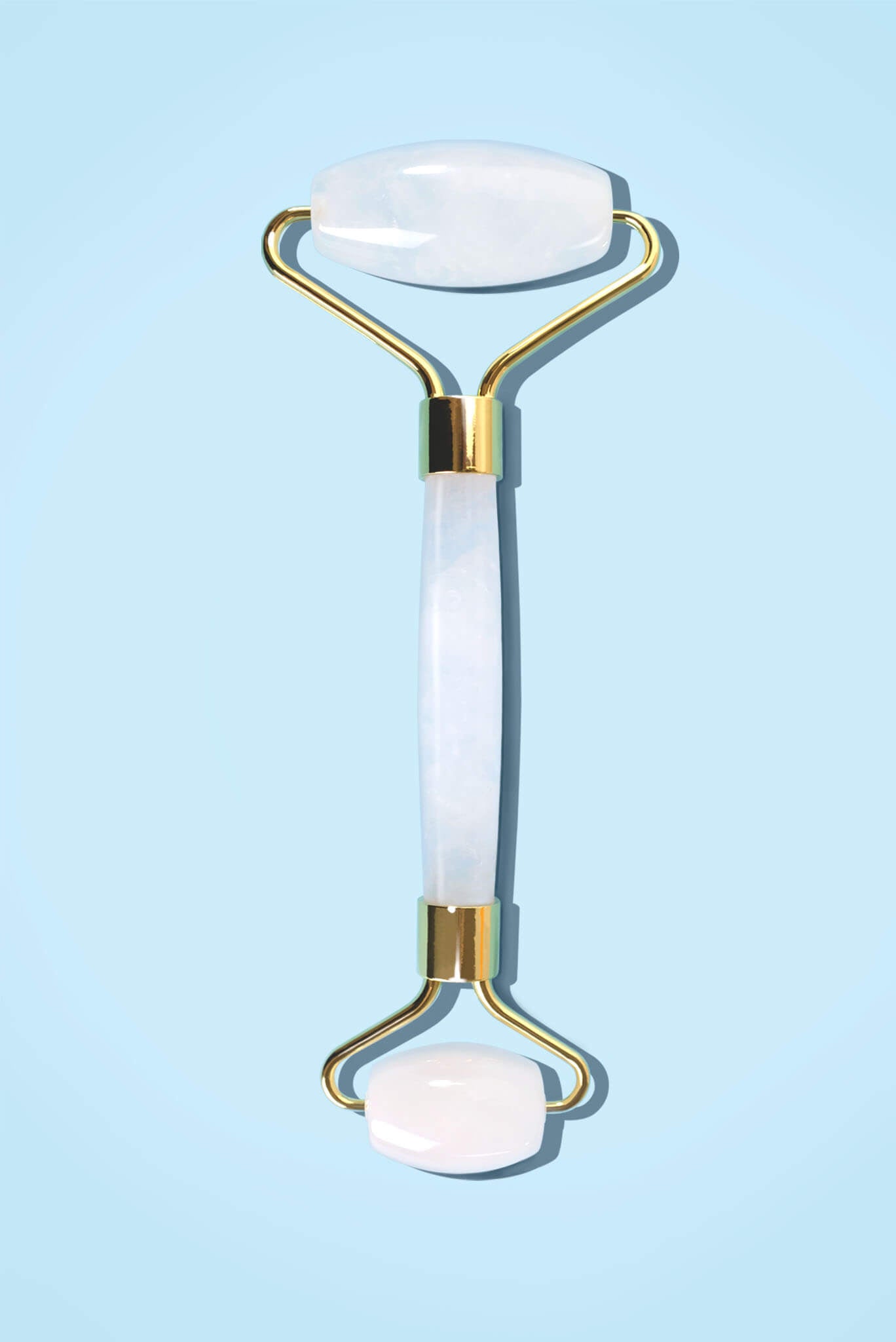 フェイスシャルローラー ミルキークォーツの正面全体画像。大小2つのローラーが付いた美顔ローラー。